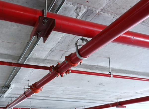 Red industrial pipes on the ceiling