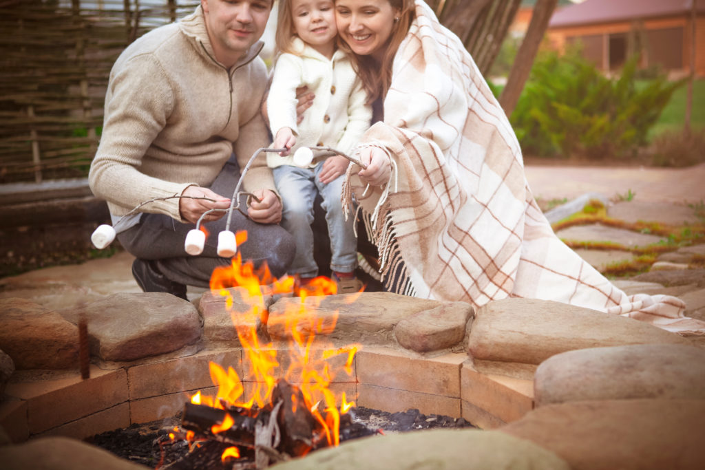 Family enjoying a bonfire together