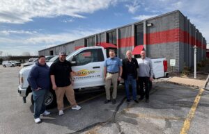 Employees next to the Summit Fire Protection truck